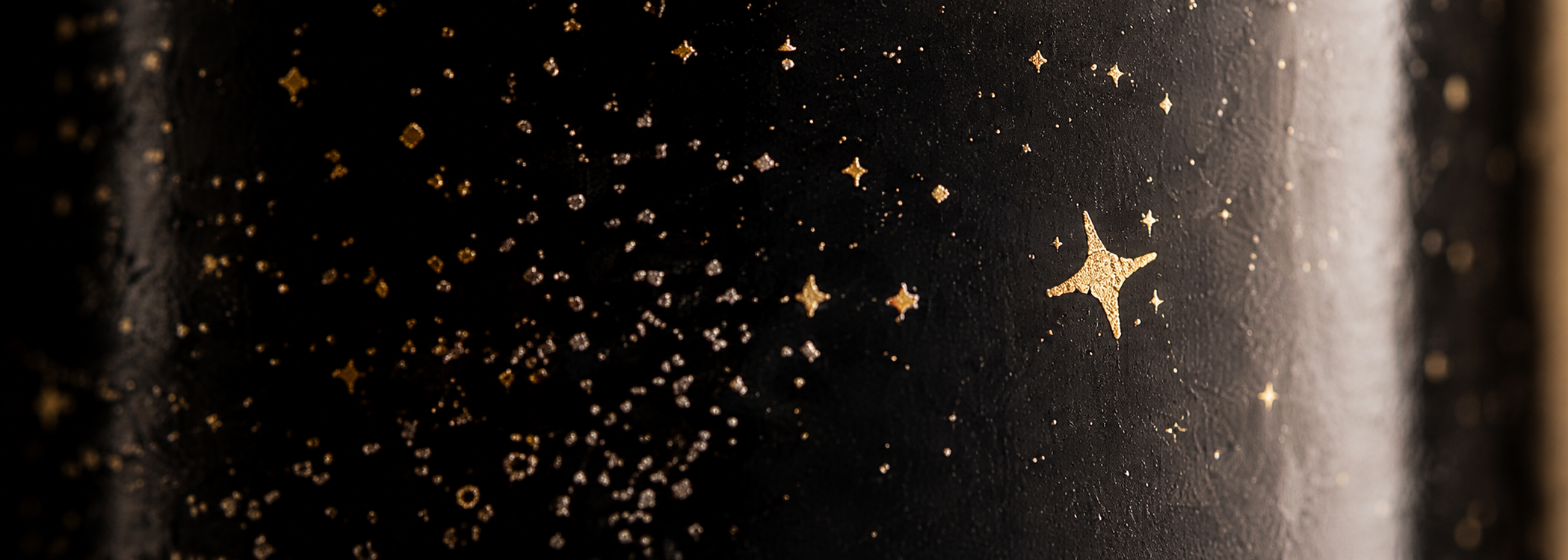 Black label with metallic gold stars